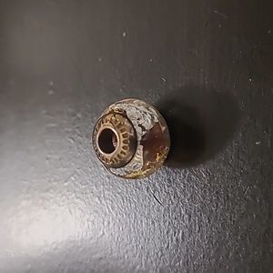 Charm with yellow and silver design